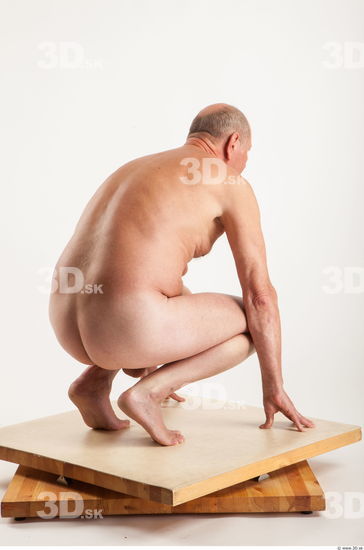 Kneeling pose of nude Ed