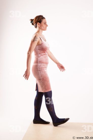 Walking reference of whole body pink dress purple tights black shoes Nadine