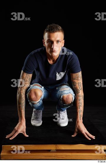 Whole Body Man White Shirt Jeans Athletic Kneeling Studio photo references