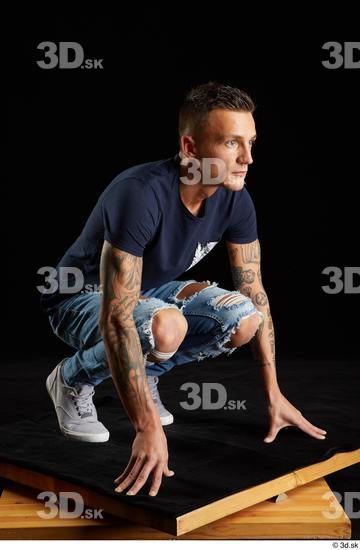 Whole Body Man White Shirt Jeans Athletic Kneeling Studio photo references