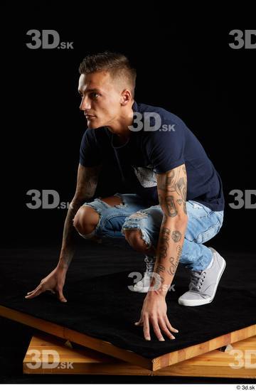 Whole Body Man White Shirt Jeans Athletic Kneeling Studio photo references