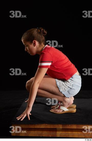 Whole Body Woman White Shirt Jeans Shorts Average Kneeling Studio photo references