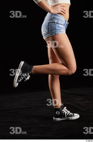 Katy Rose  black sneakers calf dressed flexing jeans shorts side view  jpg