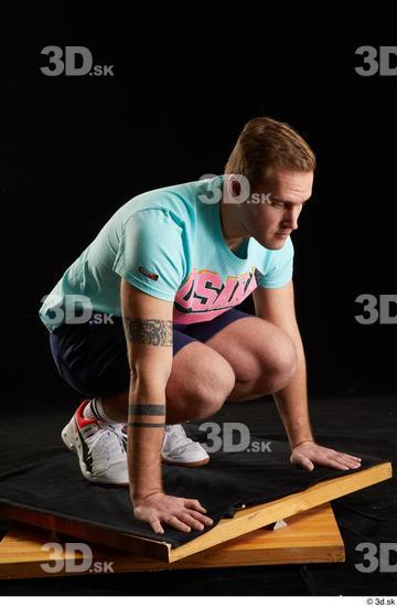 Whole Body Man White Sports Shoes Shirt T shirt Shorts Average Kneeling Studio photo references