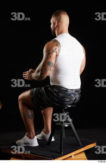 Whole Body Man White Sports Shorts Muscular Sitting Top Studio photo references