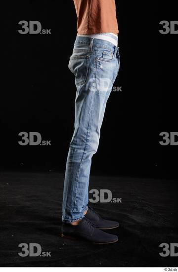 Alessandro Katz  black shoes blue jeans casual flexing leg side view  jpg