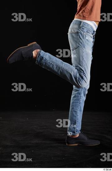 Alessandro Katz  black shoes blue jeans casual flexing leg side view  jpg