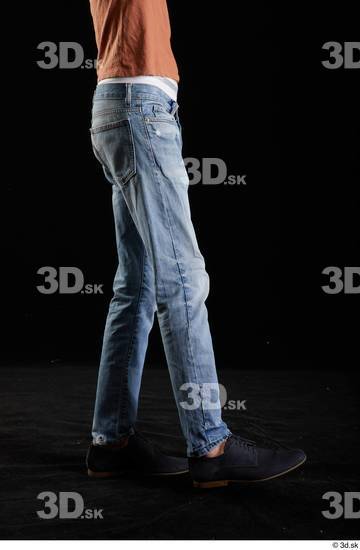 Alessandro Katz  black shoes blue jeans casual flexing leg side view  jpg