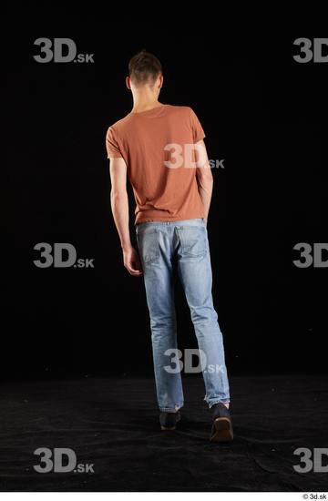 Alessandro Katz  back view black shoes blue jeans brown t shirt casual dressed walking whole body  jpg