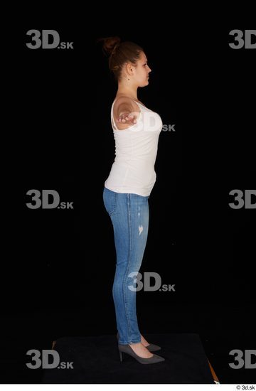 Serina Gomez blue jeans casual dressed grey high heels standing t poses white top whole body  jpg