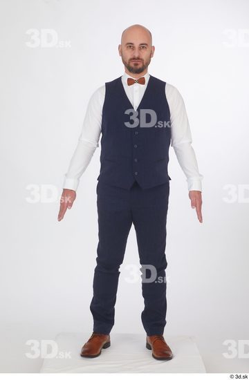 Neeo blue trousers blue vest brown oxford shoes business dressed red bow tie standing white shirt whole body  jpg