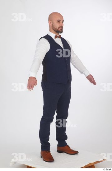 Neeo blue trousers blue vest brown oxford shoes business dressed red bow tie standing white shirt whole body  jpg