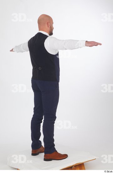 Neeo blue trousers blue vest brown oxford shoes business dressed red bow tie standing t poses white shirt whole body  jpg
