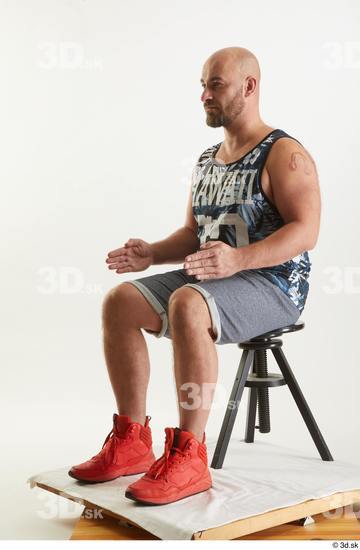 Neeo  blue shorts dressed orange sneakers sitting sports tank top whole body  jpg