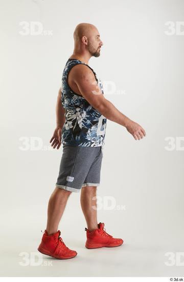 Neeo  blue shorts dressed orange sneakers side view sports tank top walking whole body  jpg