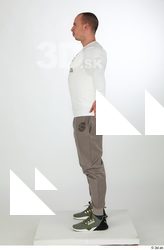 Joel a-pose dressed green sneakers grey jogger pants sports standing…