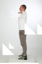 Joel dressed green sneakers grey jogger pants sports standing t-pose…
