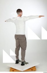Joel dressed green sneakers grey jogger pants sports standing t-pose…