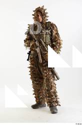 Frankie Perry Standing with Gun in Ghillie holding gun standing…