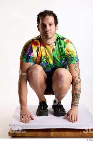 Whole Body Man White Casual Shorts Average Parrot Kneeling Studio photo references