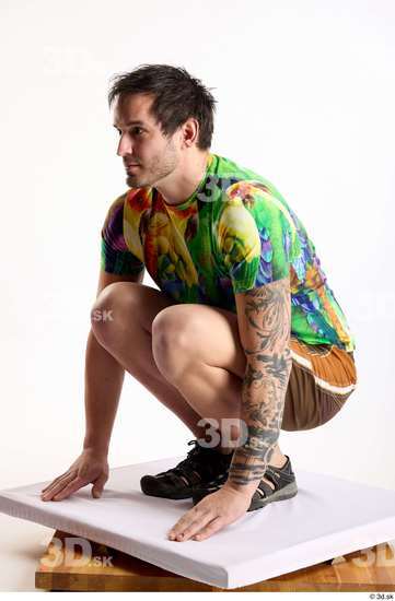 Whole Body Man White Casual Shorts Average Parrot Kneeling Studio photo references