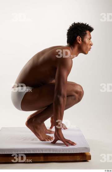 Whole Body Man Black Swimsuit Athletic Kneeling Studio photo references