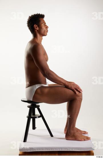 Whole Body Man Black Swimsuit Athletic Sitting Studio photo references