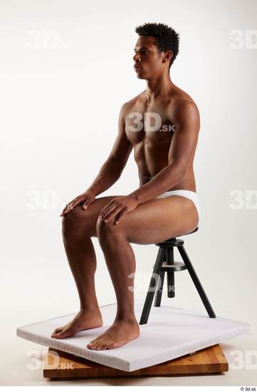 Whole Body Man Black Swimsuit Athletic Sitting Studio photo references