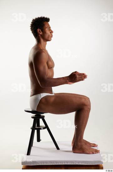 Whole Body Man Black Swimsuit Athletic Sitting Studio photo references