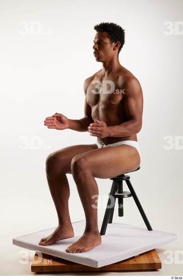 Whole Body Man Black Swimsuit Athletic Sitting Studio photo references