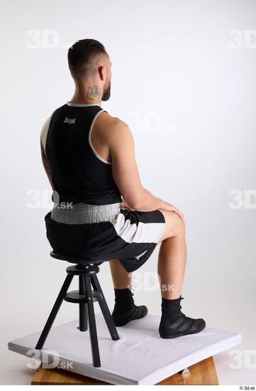 Whole Body Man White Sports Shorts Slim Athletic Sitting Top Studio photo references