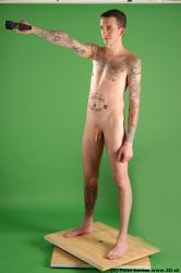 Whole Body Man Pose with pistol White Tattoo Nude Underweight Male Studio Poses