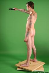 Whole Body Man Pose with pistol White Tattoo Nude Underweight Male Studio Poses