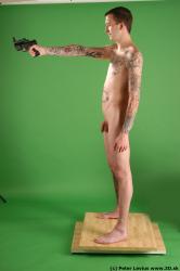 Whole Body Man Pose with pistol White Tattoo Nude Underweight Male Studio Poses