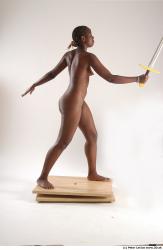 Whole Body Woman Pose with sword Black Nude Athletic Studio photo references